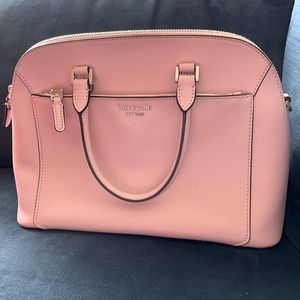 A light pink gently used purse.